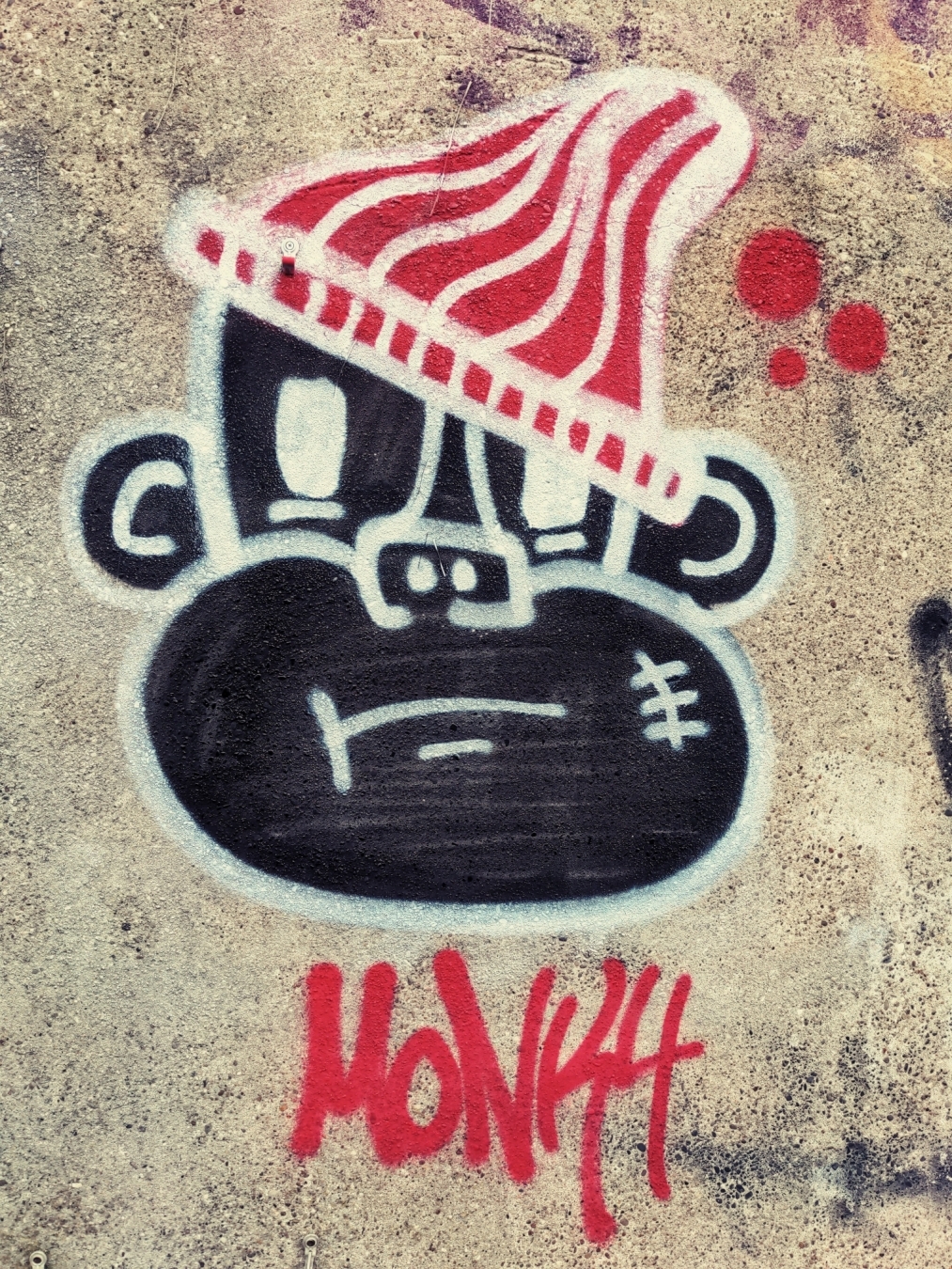 Graffiti eines Affenkopfes.